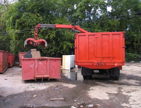 Protective equipment and safety signage at a waste collection site